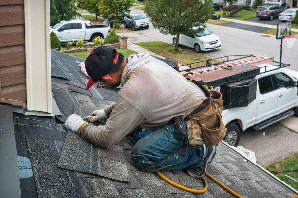 Professional Roofing technician working in Dorchester Center, MA